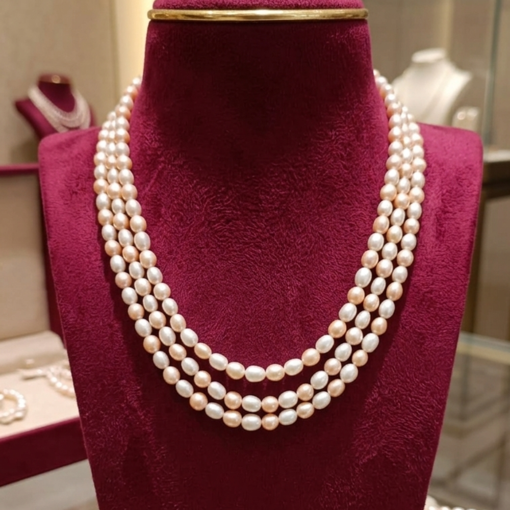Elegant Three-Strand Peach & White Pearl Necklace