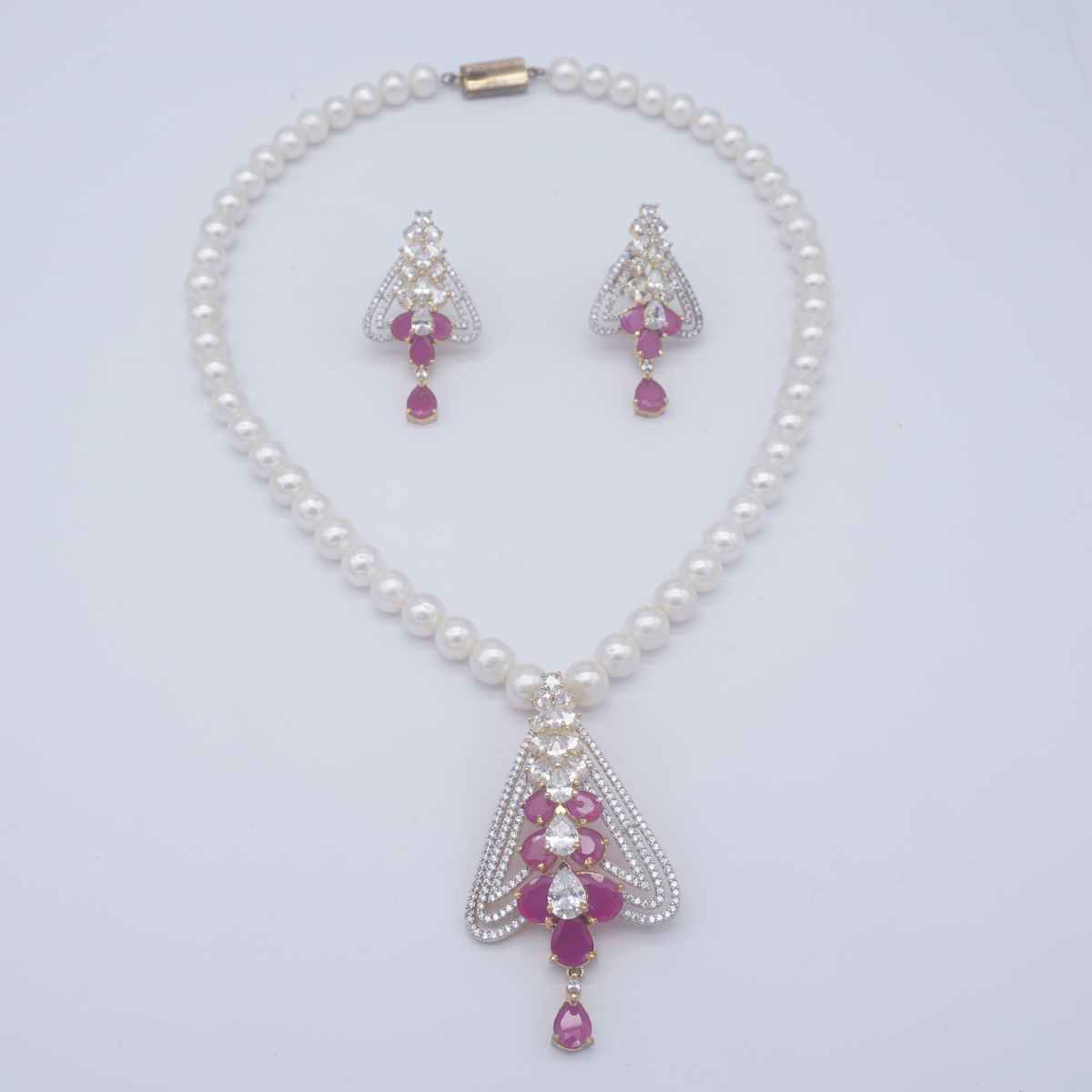 Fresh Water single row round shape white colour pearls & coloured stones in locket & earings